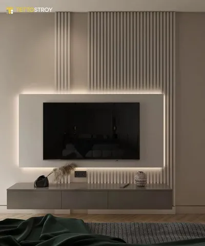 Bež TV zid sa letvicama i LED svetlom koje uokviruje ravnu površinu iza televizora